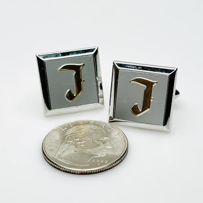 Vintage Swank initial J cufflinks beside quarter showing square design and size