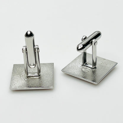 Reverse Side view of vintage Swank cufflinks showing silver tone swivel bar closures