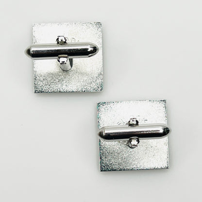 Reverse of vintage Swank square cufflinks showing swivel backs and maker markings
