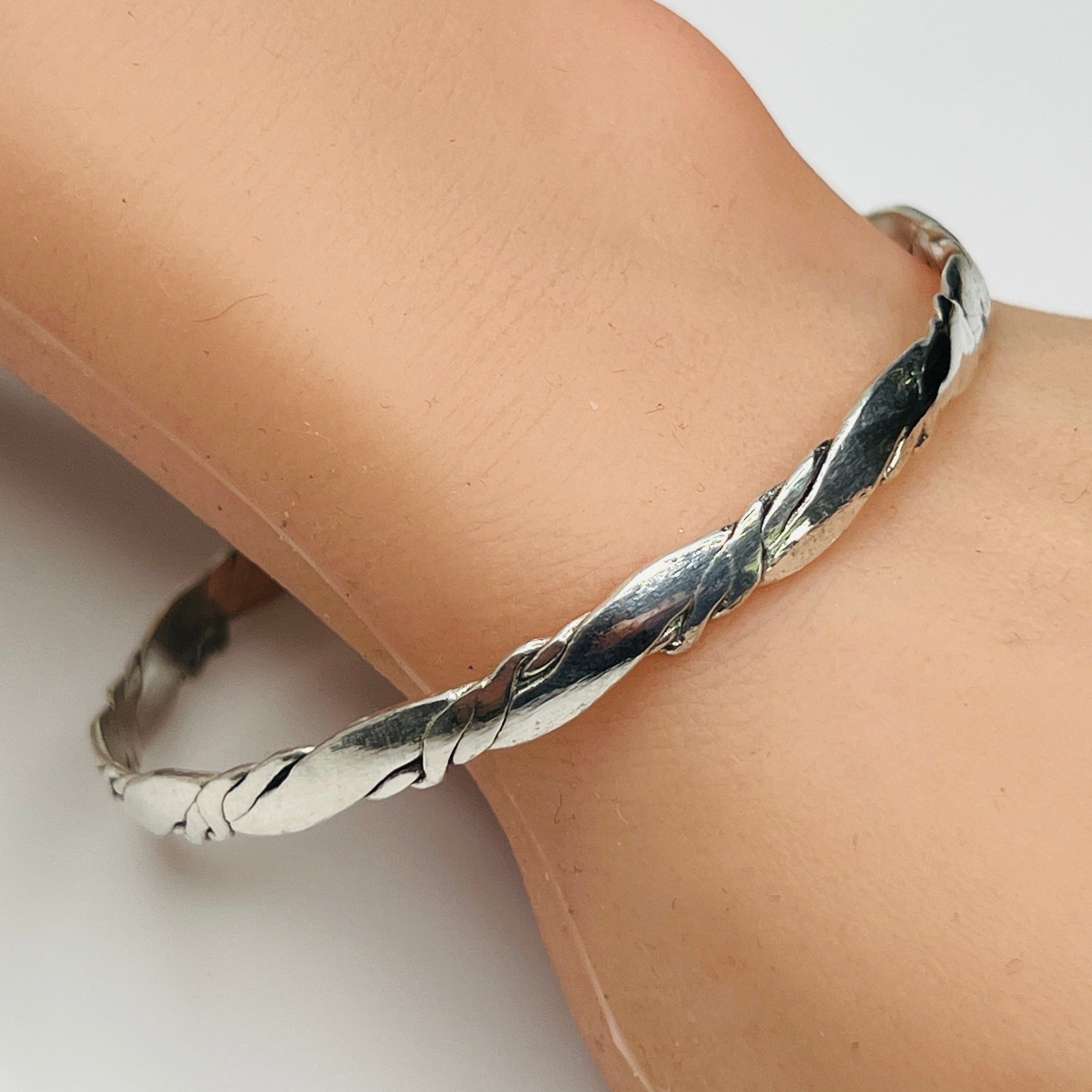 1980s sterling silver bangle worn on wrist