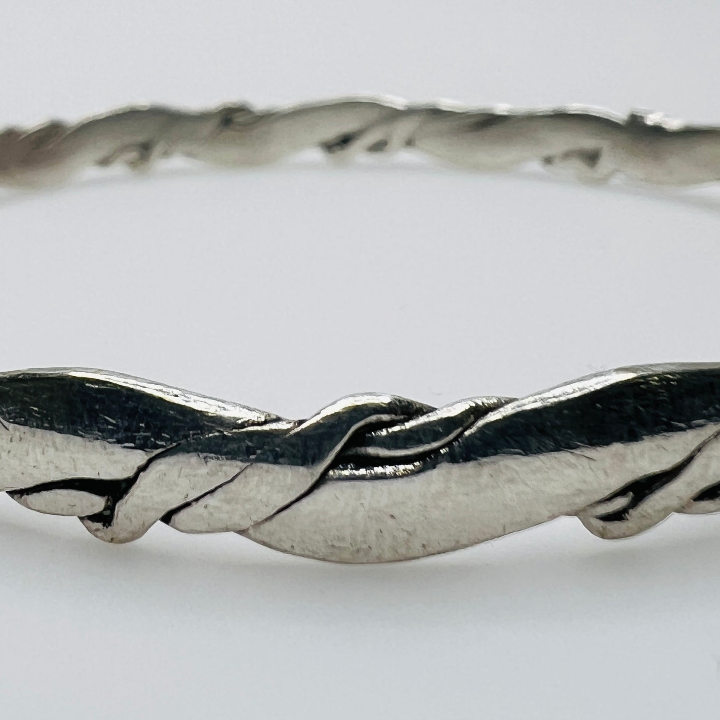 Close-up of twisted sterling silver bracelet detail