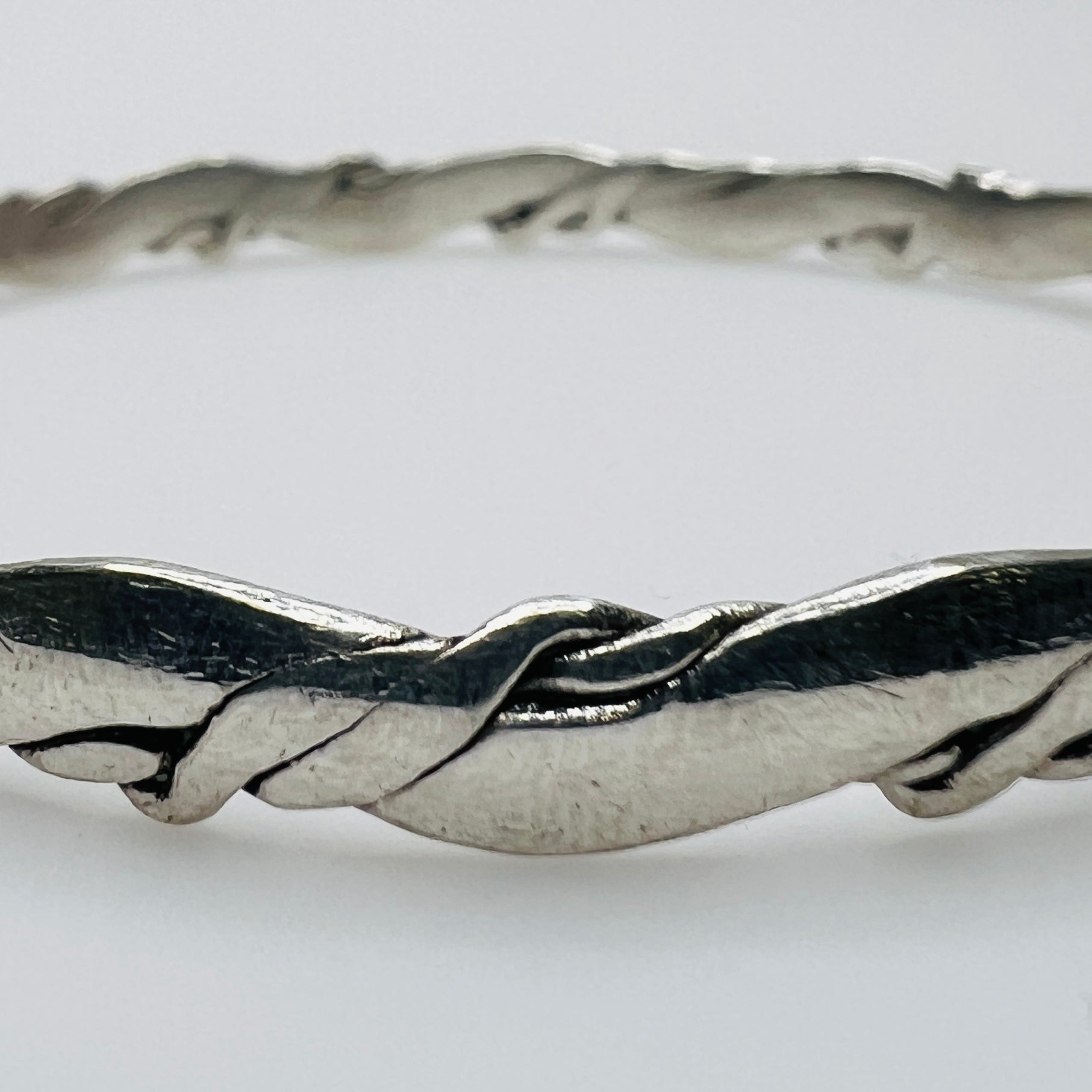 Close-up of twisted sterling silver bracelet detail