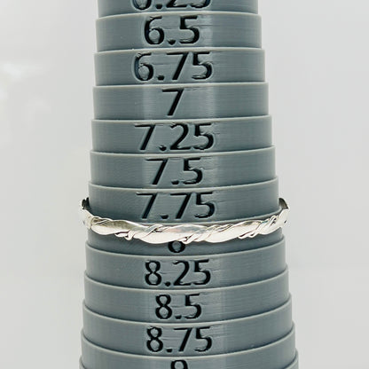 Vintage silver bangle bracelet shown with sizing mandrel