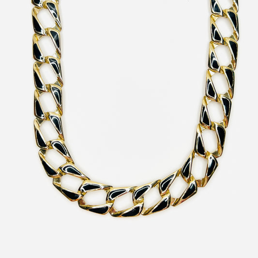 Vintage 1980s gold tone link necklace with glossy black enamel accents.
