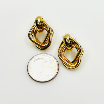Vintage gold tone geometric earrings with quarter for size reference