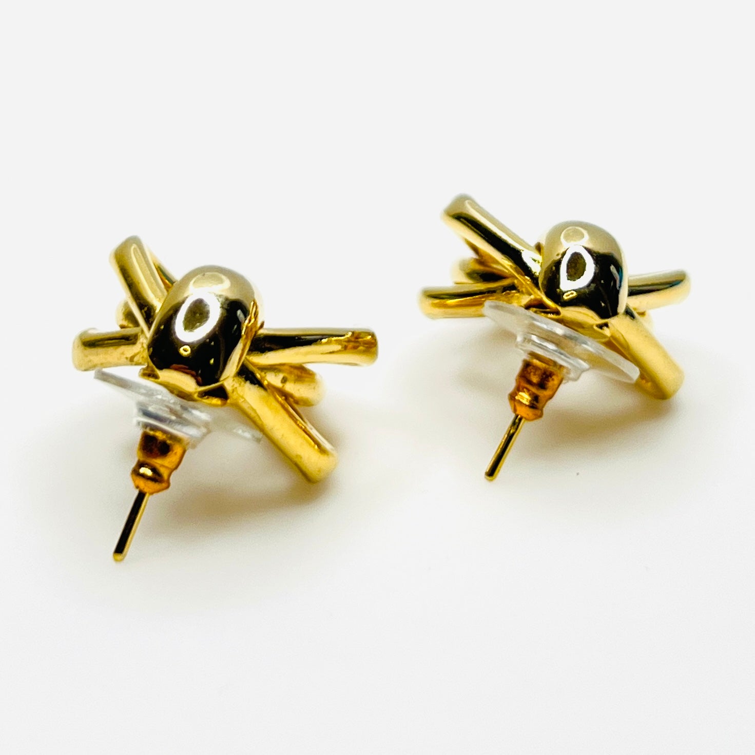 Side view of 1980s gold tone stationary door knocker earrings