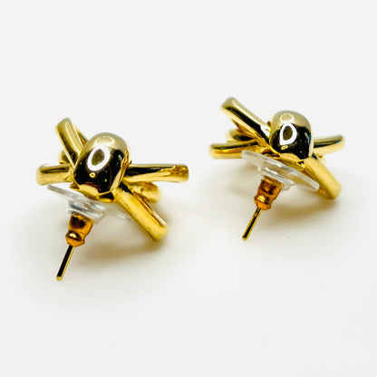 Side view of 1980s gold tone stationary door knocker earrings