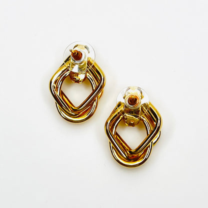 Back view of vintage gold tone pierced earrings with stabilizer backs