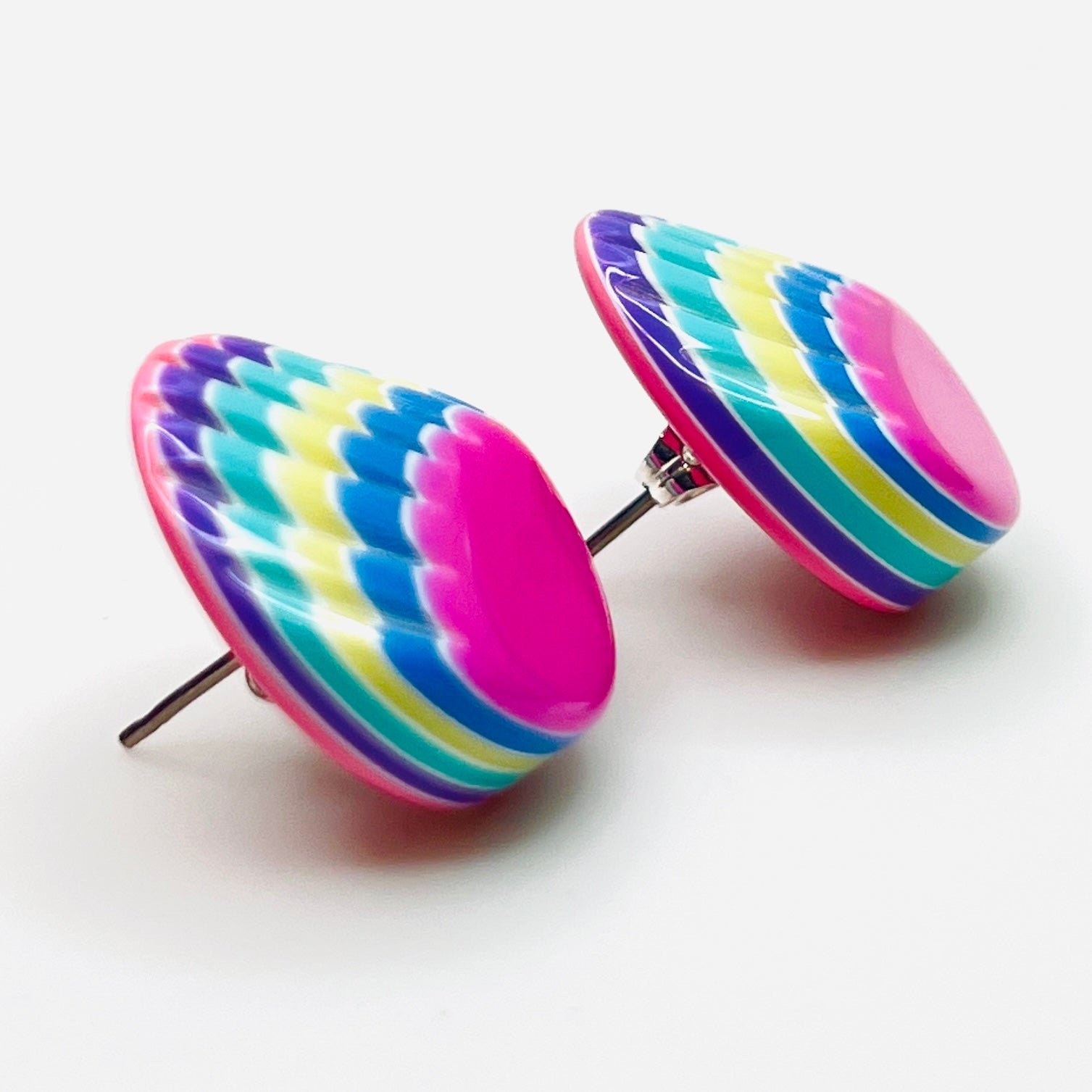 Side view of vintage colorful resin stud earrings with silver-tone posts