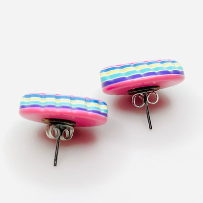 Side view of vintage colorful resin stud earrings with silver-tone posts
