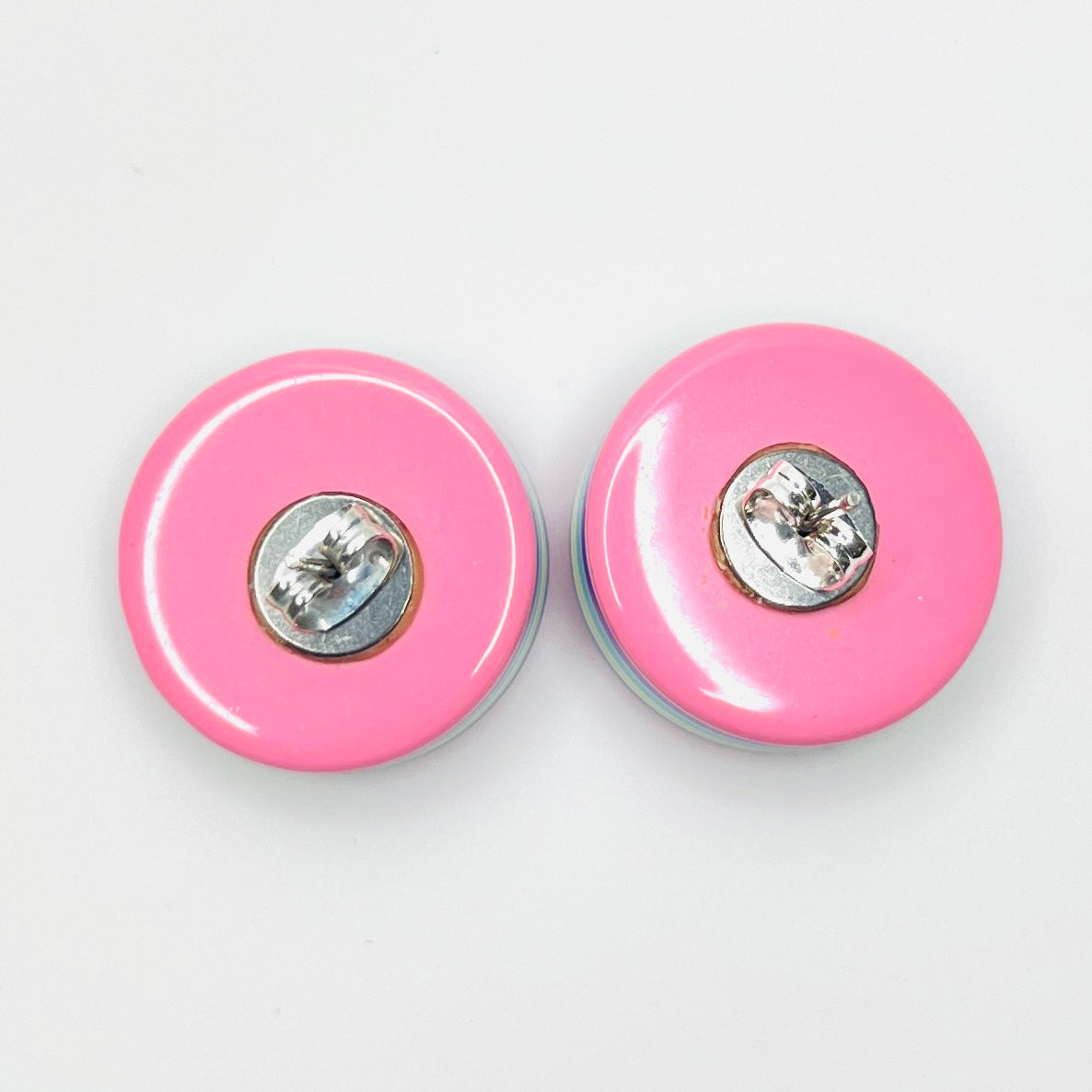 Back view of vintage 1980s resin stud earrings with butterfly backs