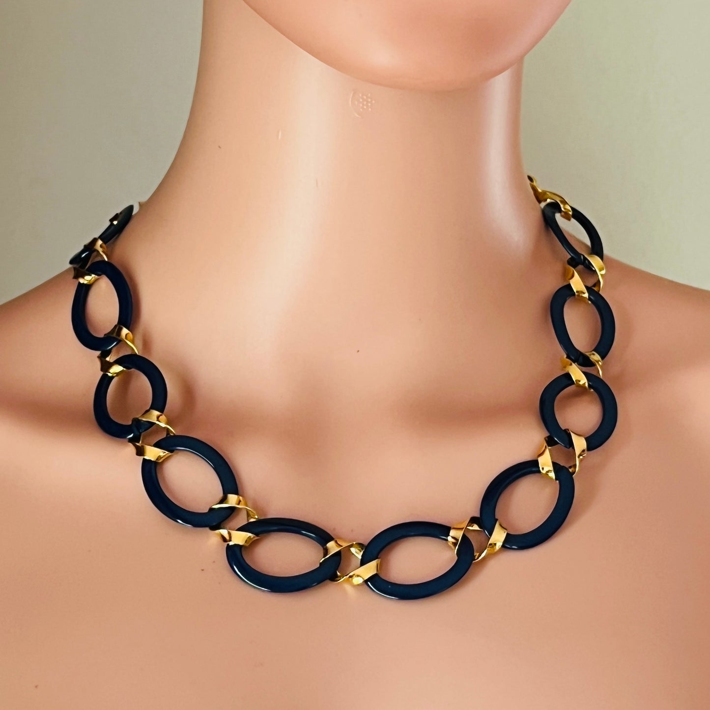 Vintage Monet navy enamel and gold link necklace on mannequin
