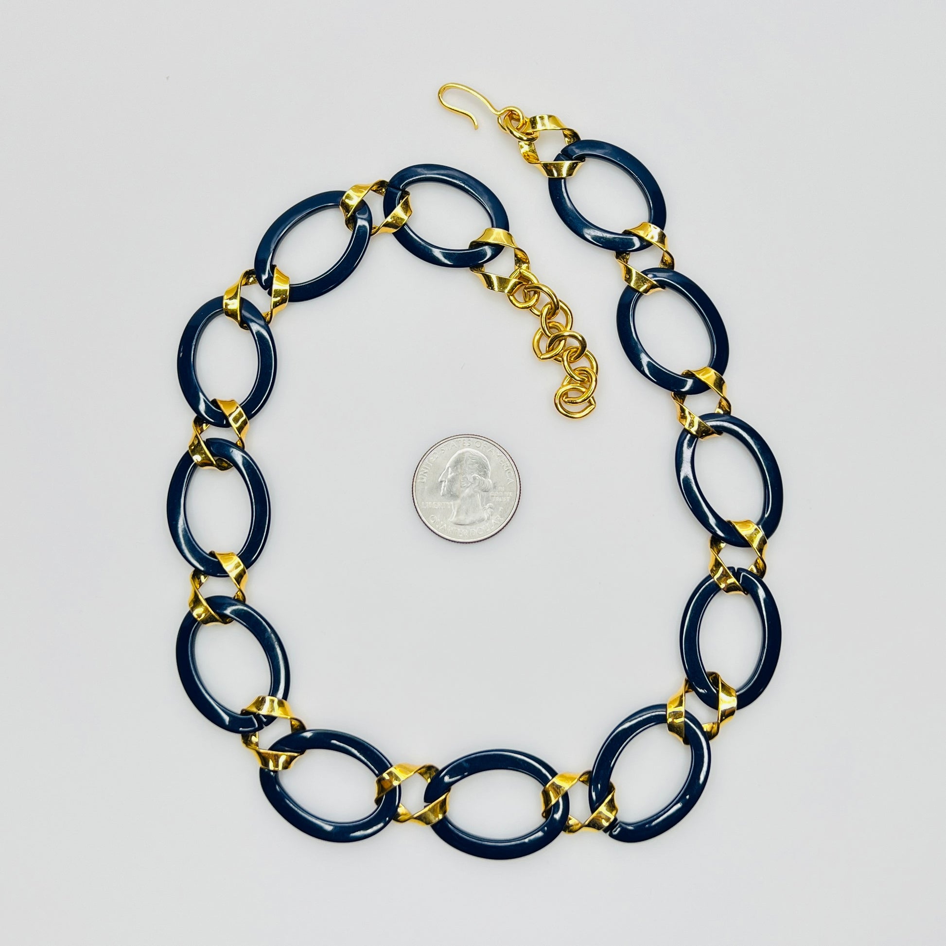 Monet navy blue enamel chain necklace with gold links flat lay