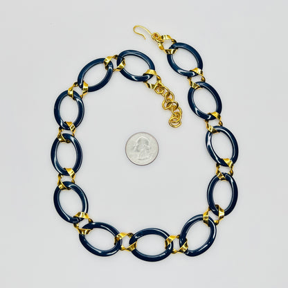 Monet navy blue enamel chain necklace with gold links flat lay
