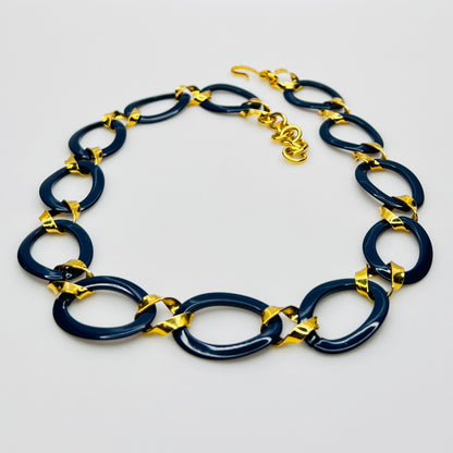 Monet navy blue enamel chain necklace with gold links flat lay