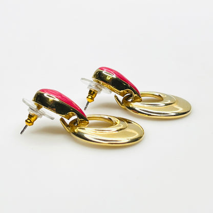 Side profile of Orion gold tone and red enamel statement earrings