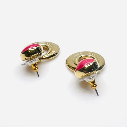 Side profile of Orion gold tone and red enamel statement earrings