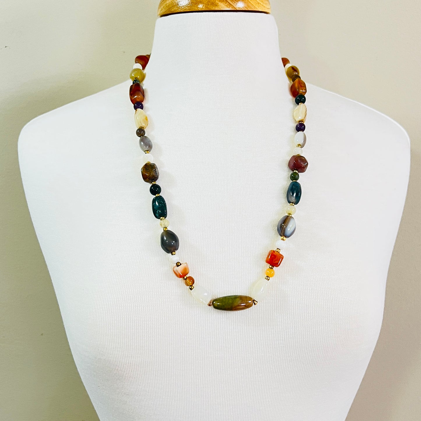 1980s multi stone bead necklace displayed on mannequin