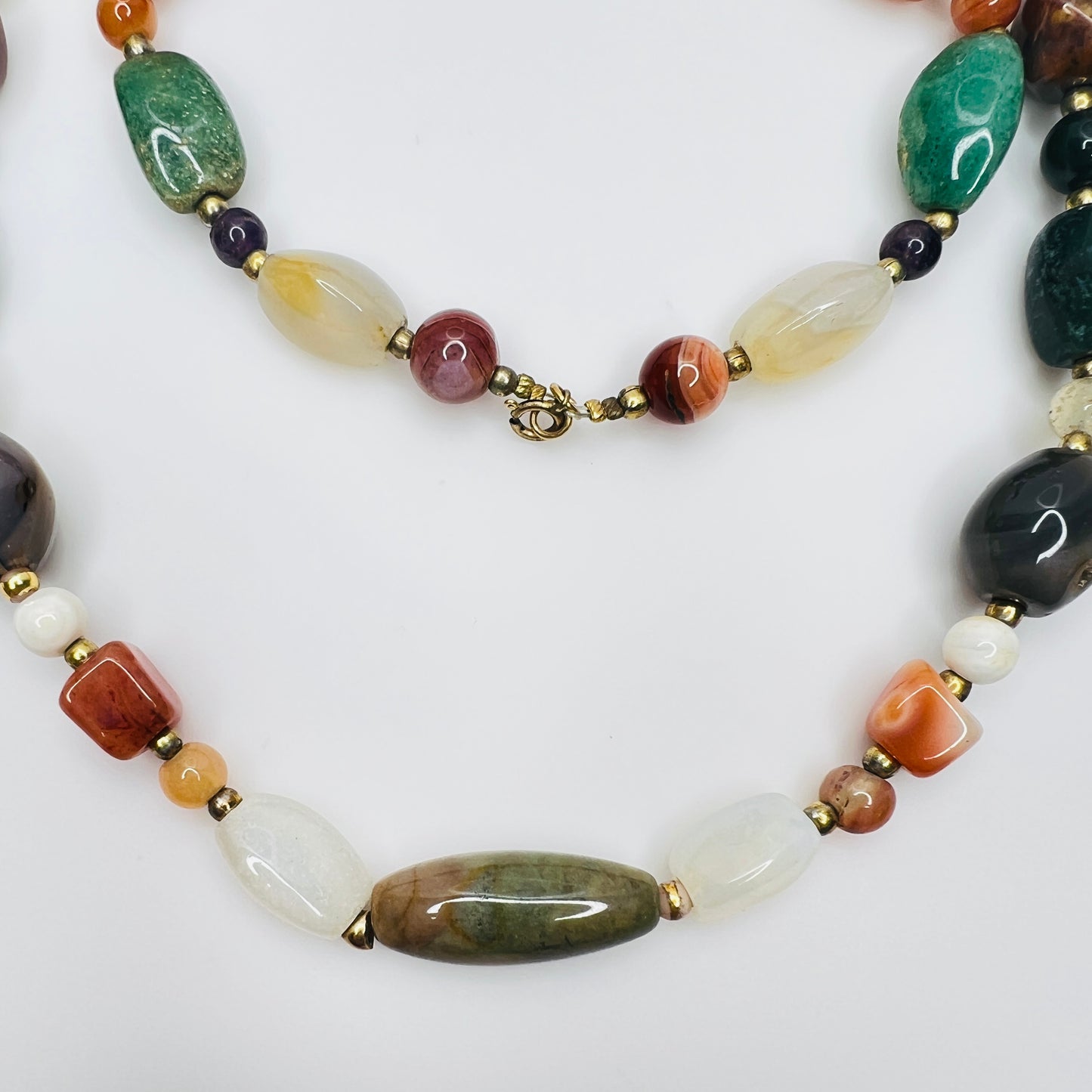 Vintage gemstone necklace with assorted polished stones and clasp