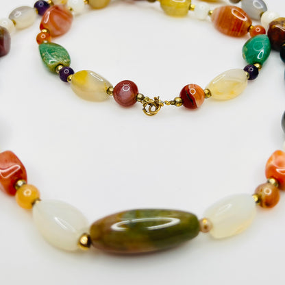 Detail of natural stone beads in vintage gemstone necklace