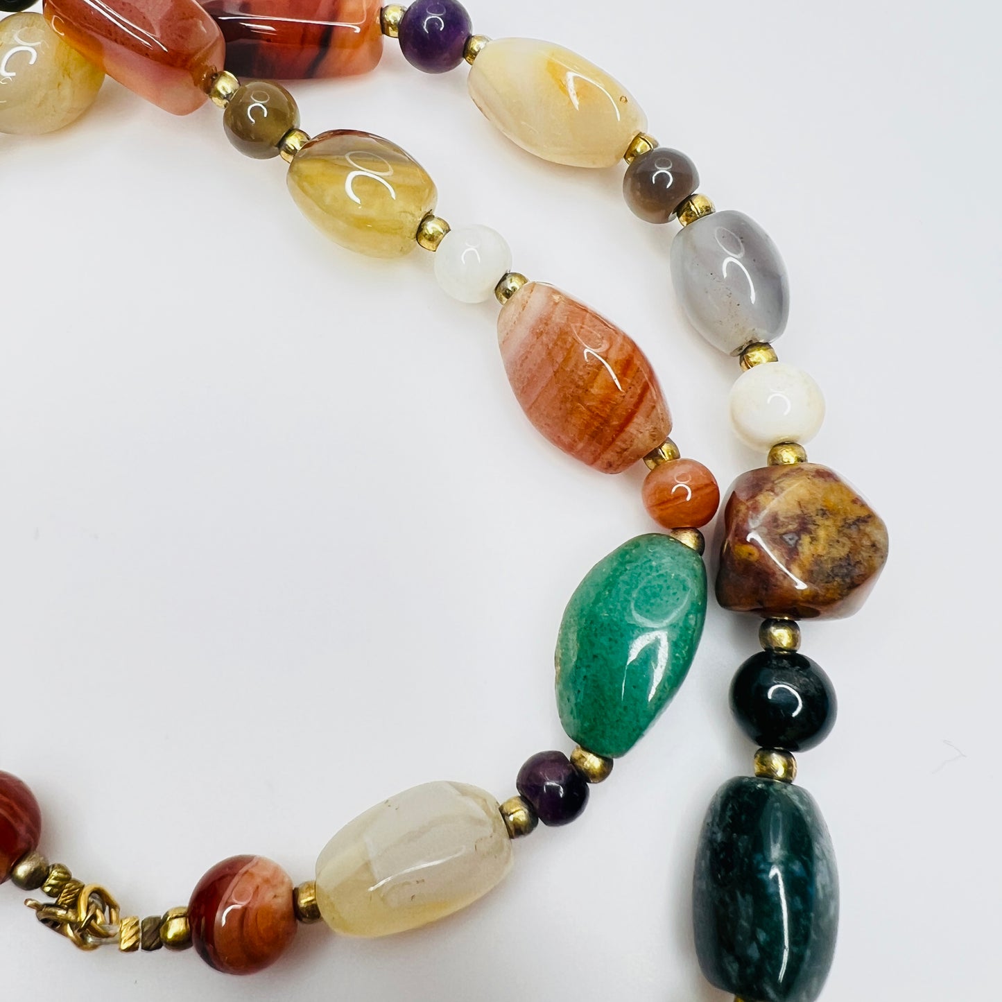 Detail of natural stone beads in vintage gemstone necklace