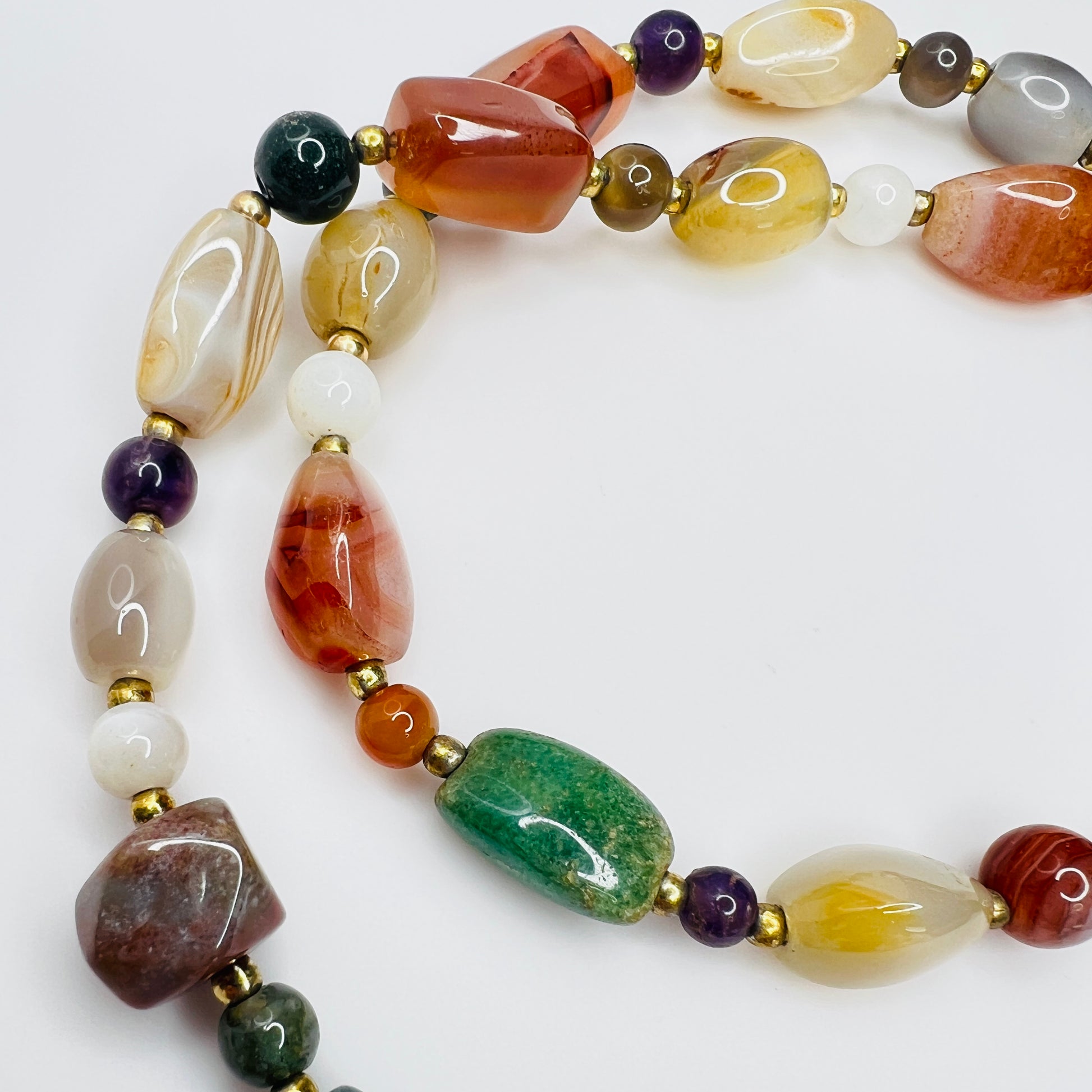 Detail of natural stone beads in vintage gemstone necklace