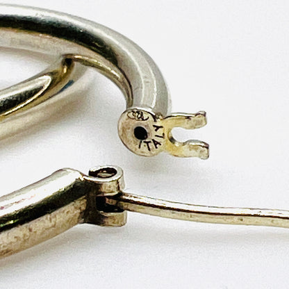 Close-up of 925 Italy hallmark on vintage sterling silver hoop earrings