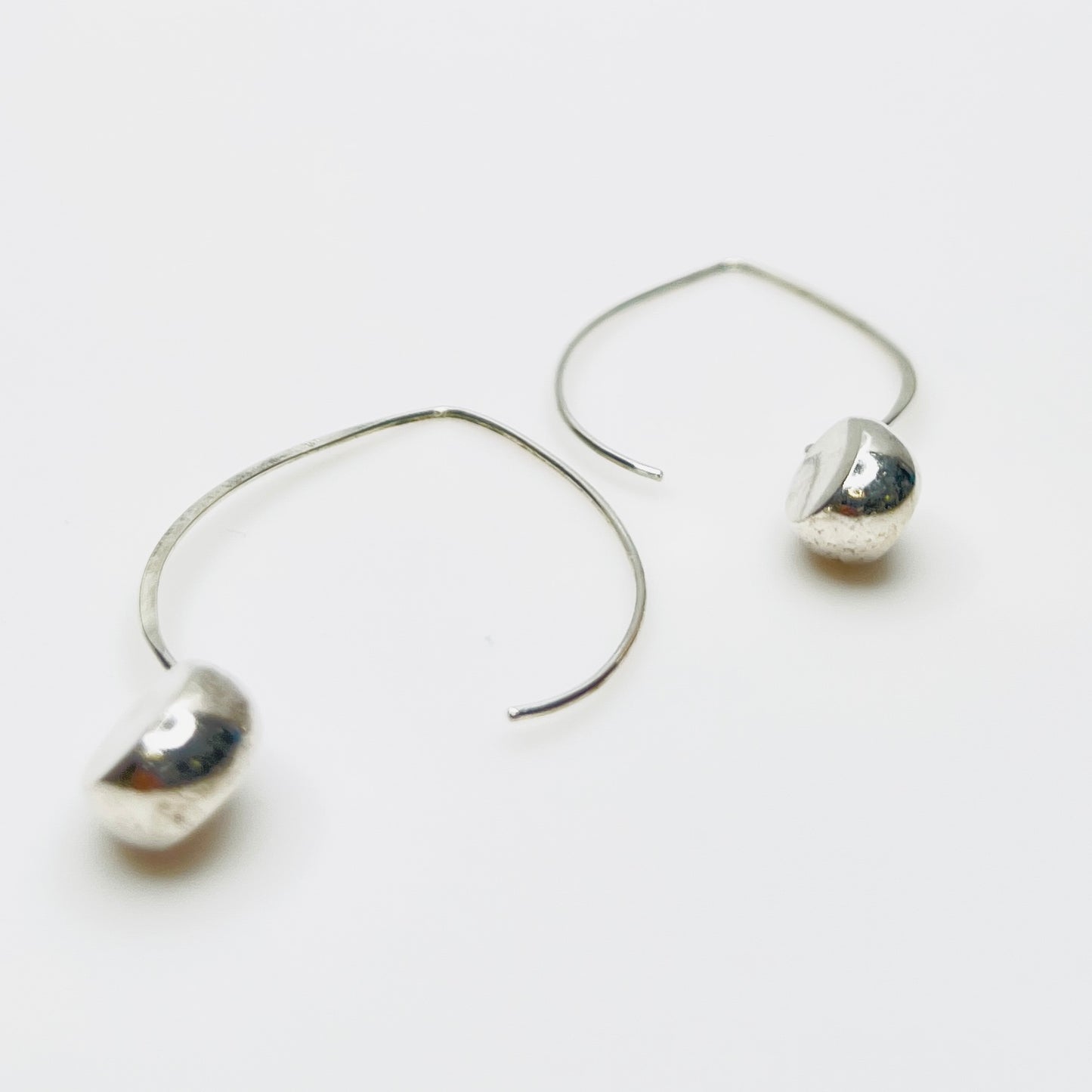 Modernist sterling silver oval drop earrings with elongated wire design