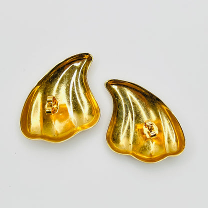Back view of vintage 1980s gold tone pierced statement earrings