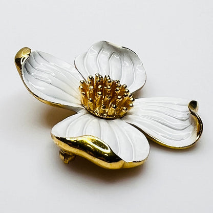 Side profile of vintage Trifari white enamel dogwood brooch showing dimensional petals.