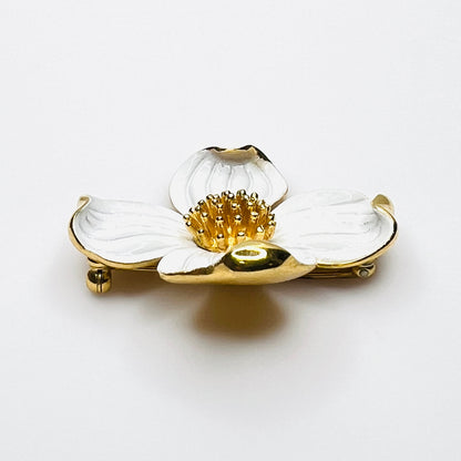 Side profile of vintage Trifari white enamel dogwood brooch showing dimensional petals.