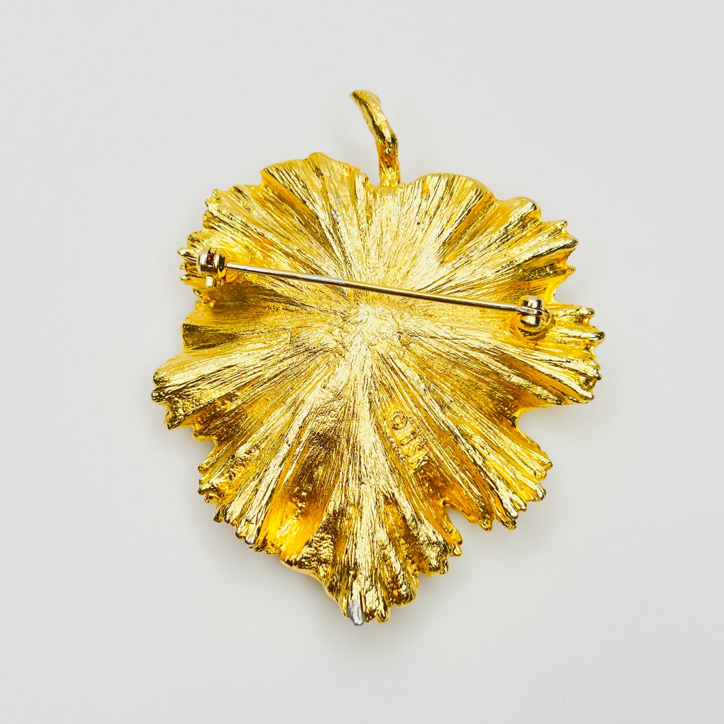 Reverse of signed BSK botanical brooch