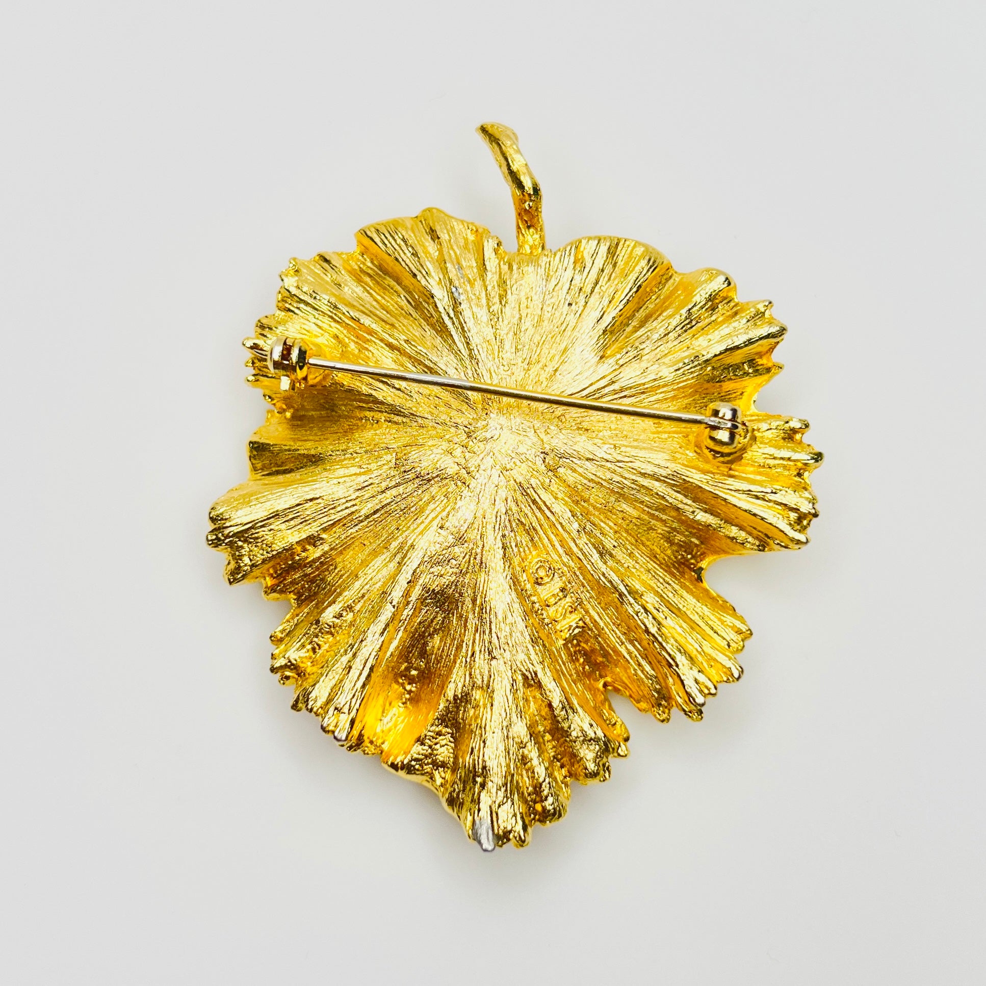 Reverse of signed BSK botanical brooch