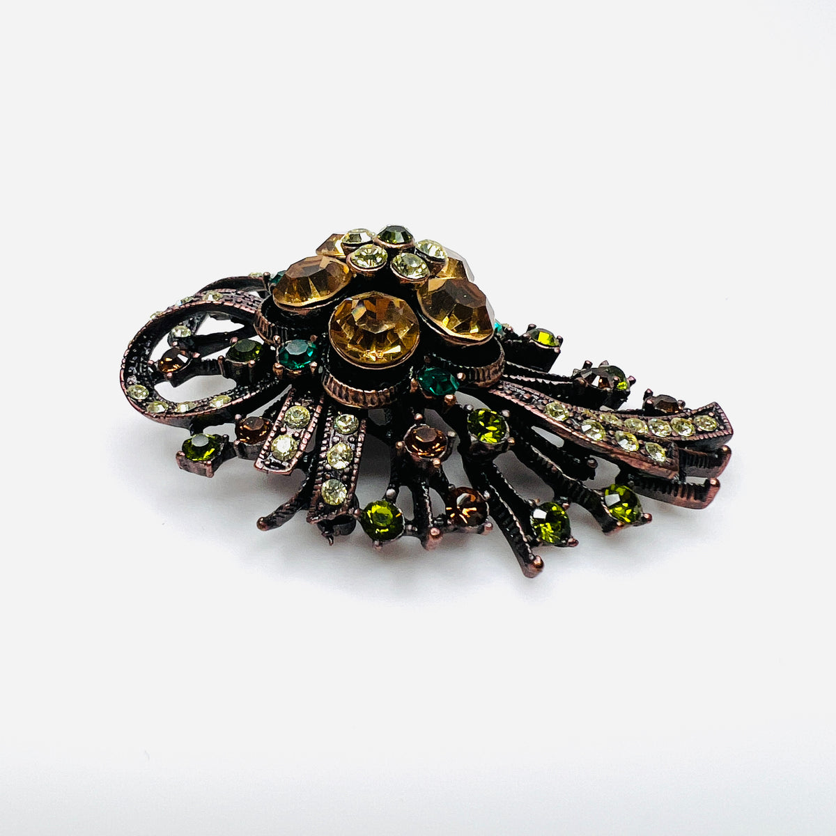Side view of dimensional Joan Rivers floral brooch with multicolor rhinestones