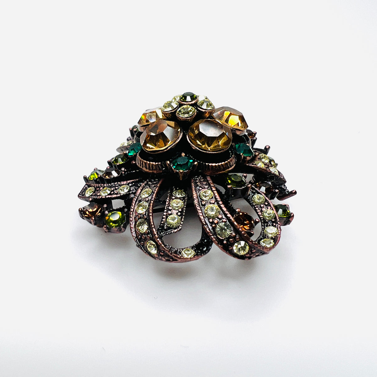 Side view of dimensional Joan Rivers floral brooch with multicolor rhinestones