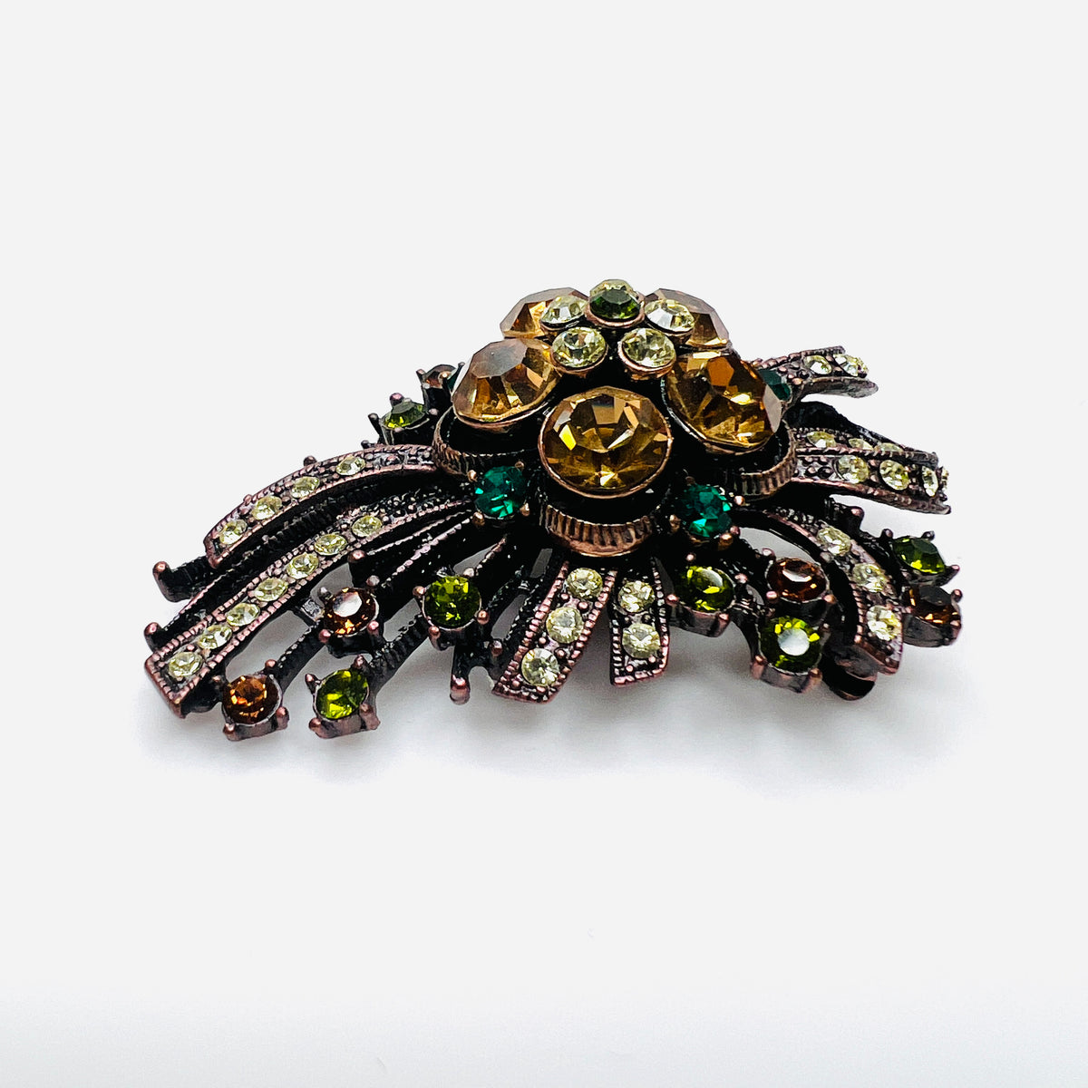 Side view of dimensional Joan Rivers floral brooch with multicolor rhinestones