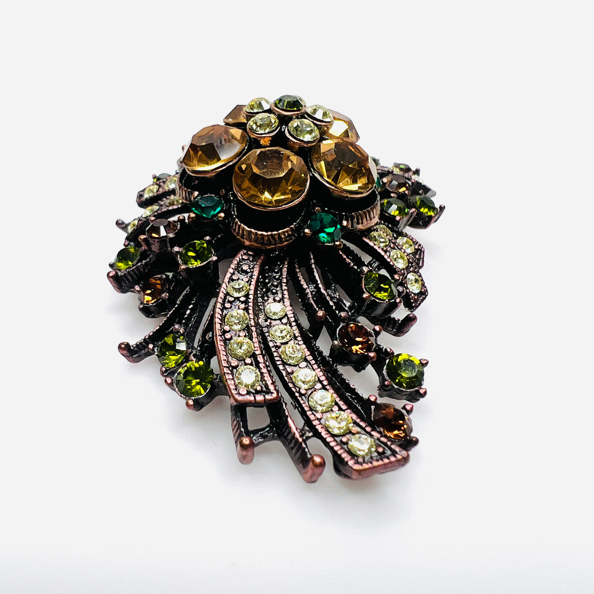 Side view of dimensional Joan Rivers floral brooch with multicolor rhinestones