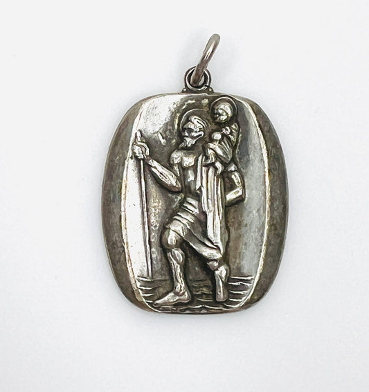 Vintage M. De Jean sterling silver St. Christopher medal pendant with raised religious relief.