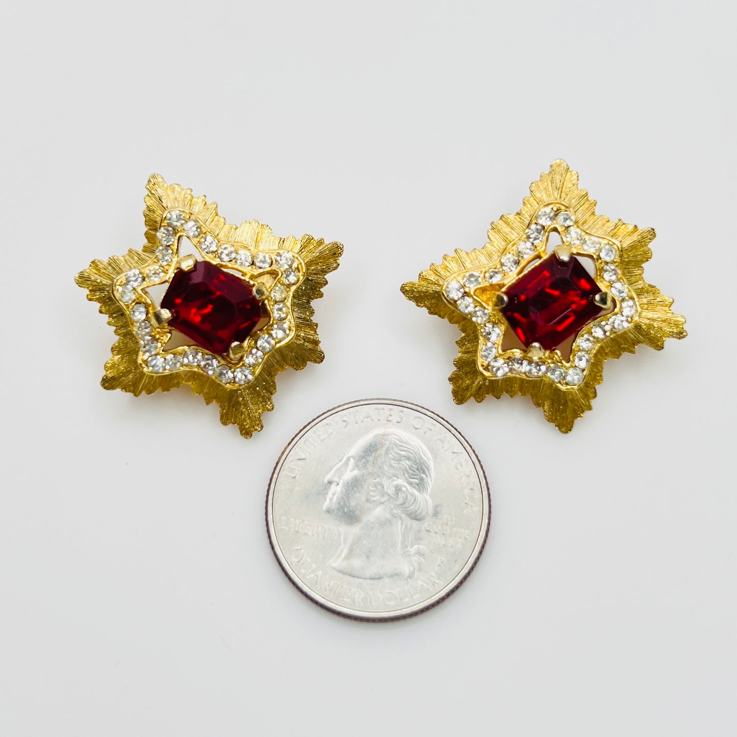 1950s Park Lane red and clear rhinestone clip earrings with quarter