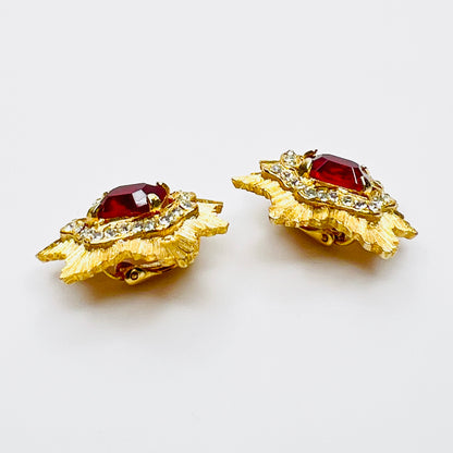 Side view of vintage gold-tone ruby rhinestone clip-on earrings