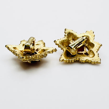 Side view of vintage gold-tone ruby rhinestone clip-on earrings