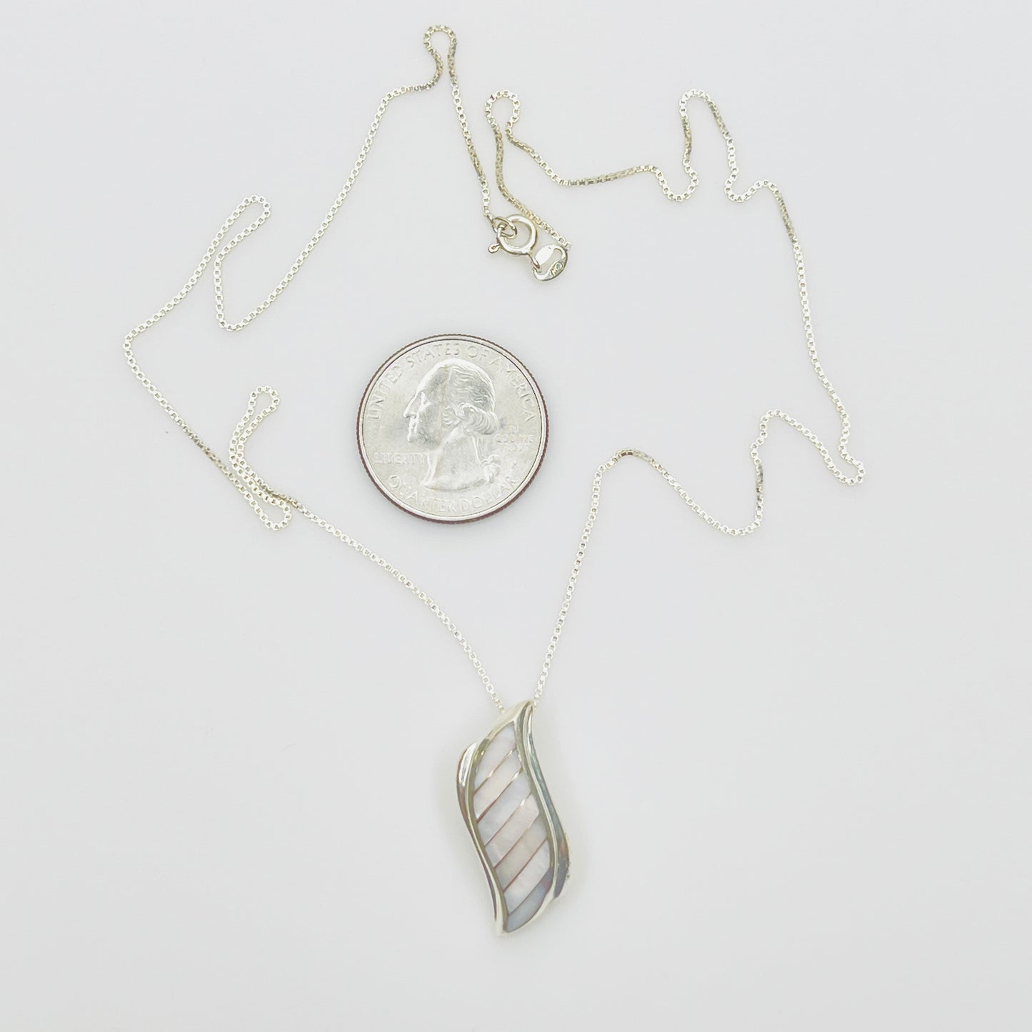 Vintage silver pendant with iridescent shell inlay curved design