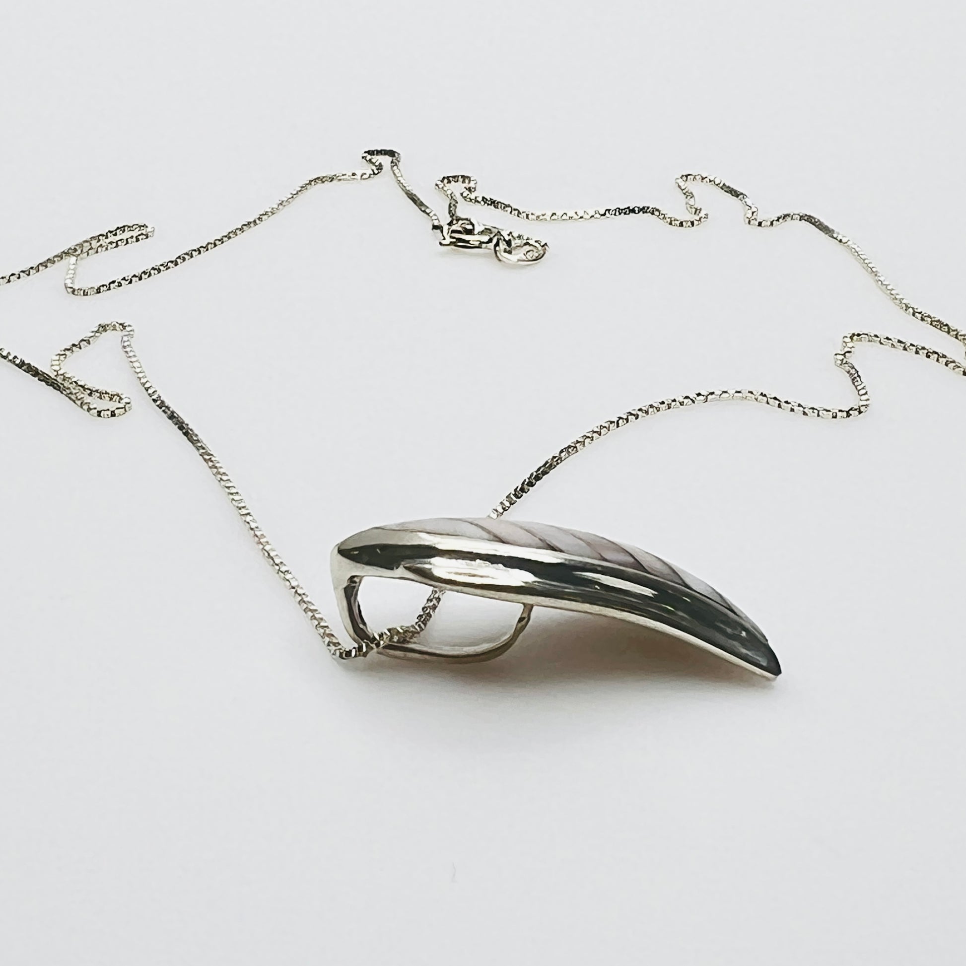 Side view sterling silver wave pendant mother of pearl detail