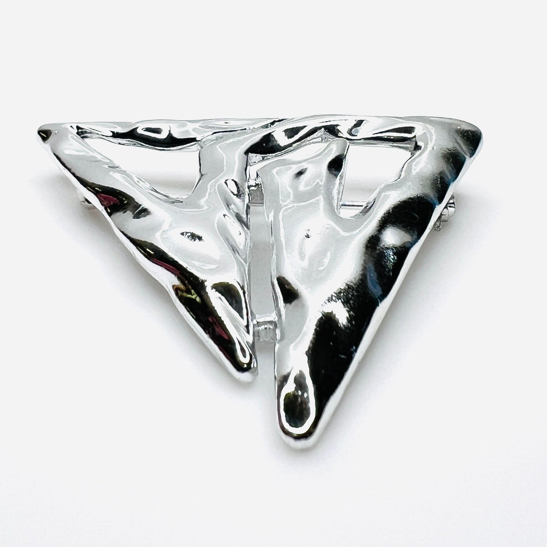 Side profile of vintage Torino abstract geometric brooch showing dimensional sculptural form.