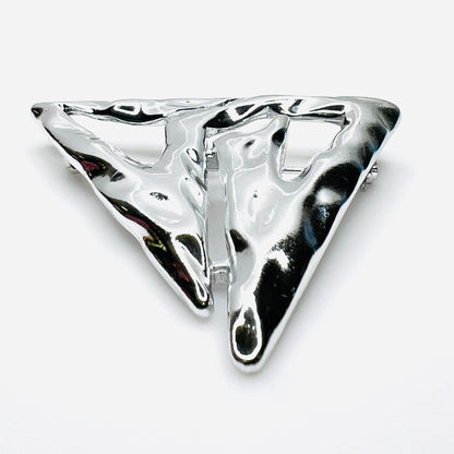 Side profile of vintage Torino abstract geometric brooch showing dimensional sculptural form.