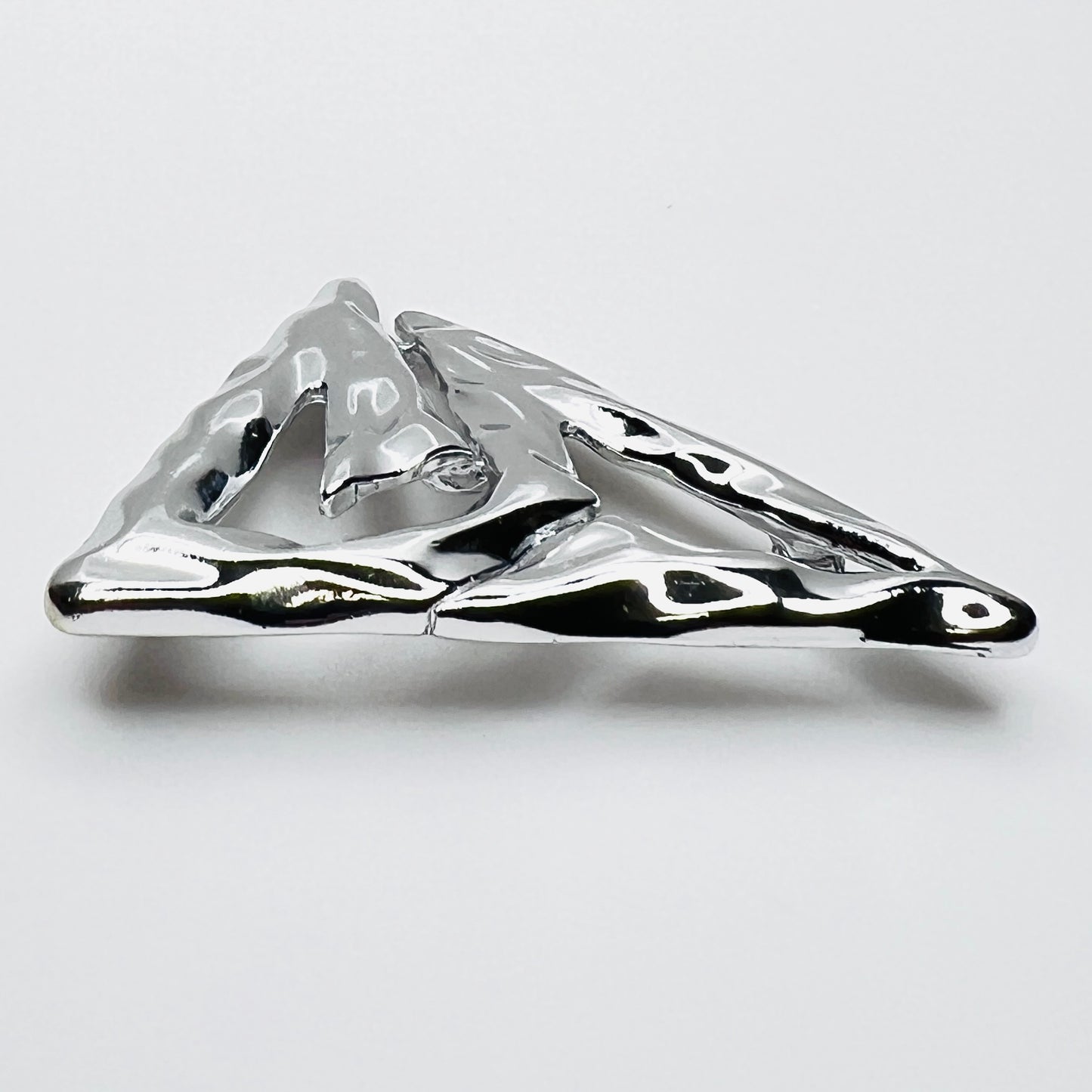 Side profile of vintage Torino abstract geometric brooch showing dimensional sculptural form.