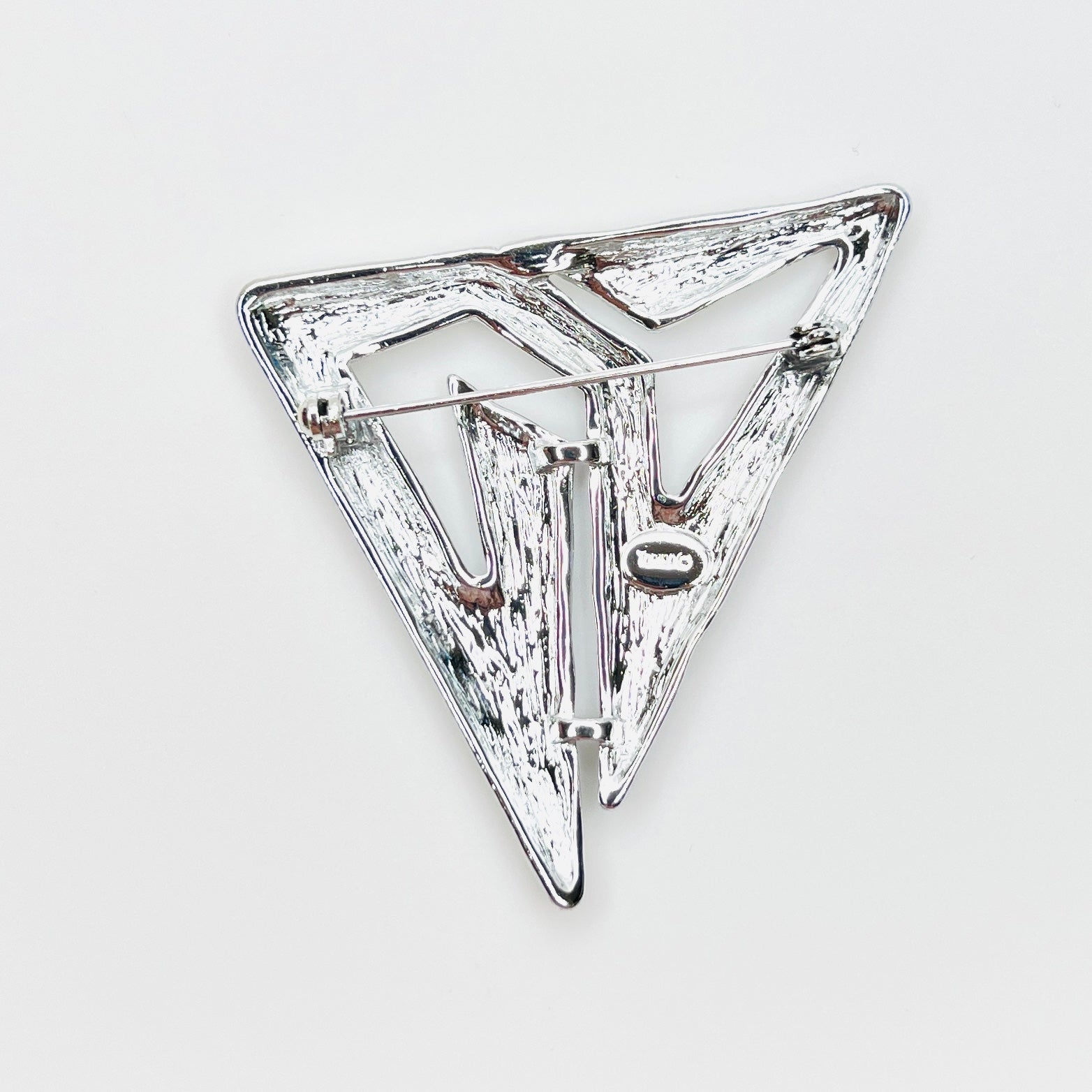 Reverse of signed Torino silver-tone Modernist brooch with secure pin clasp.