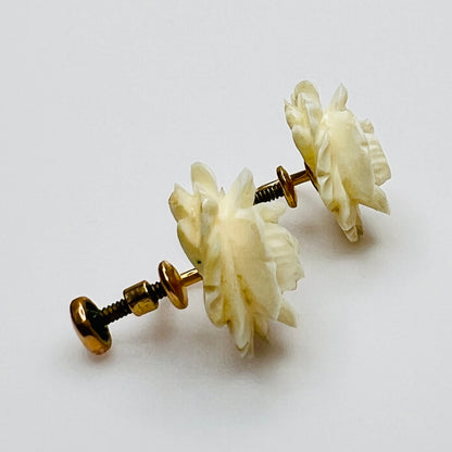 Side view of vintage screwback earrings with carved rose tops