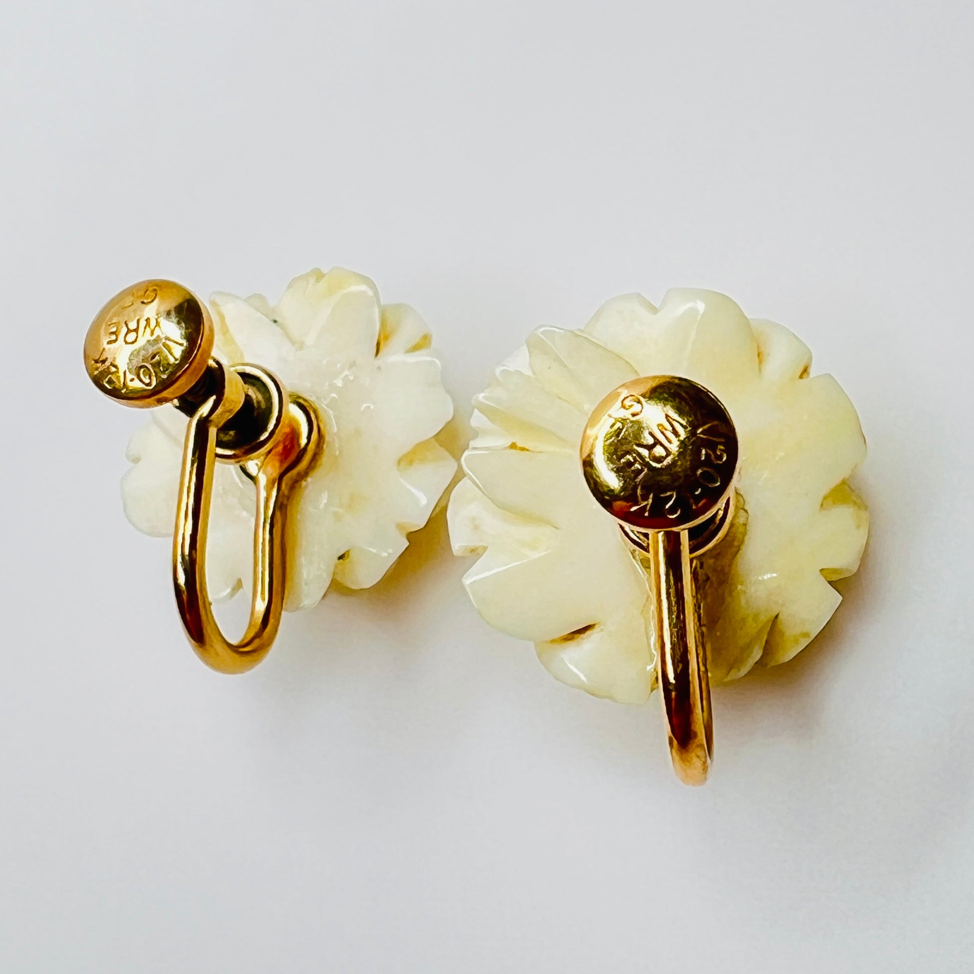 Back of earrings showing WRE 12K GF screwback closure