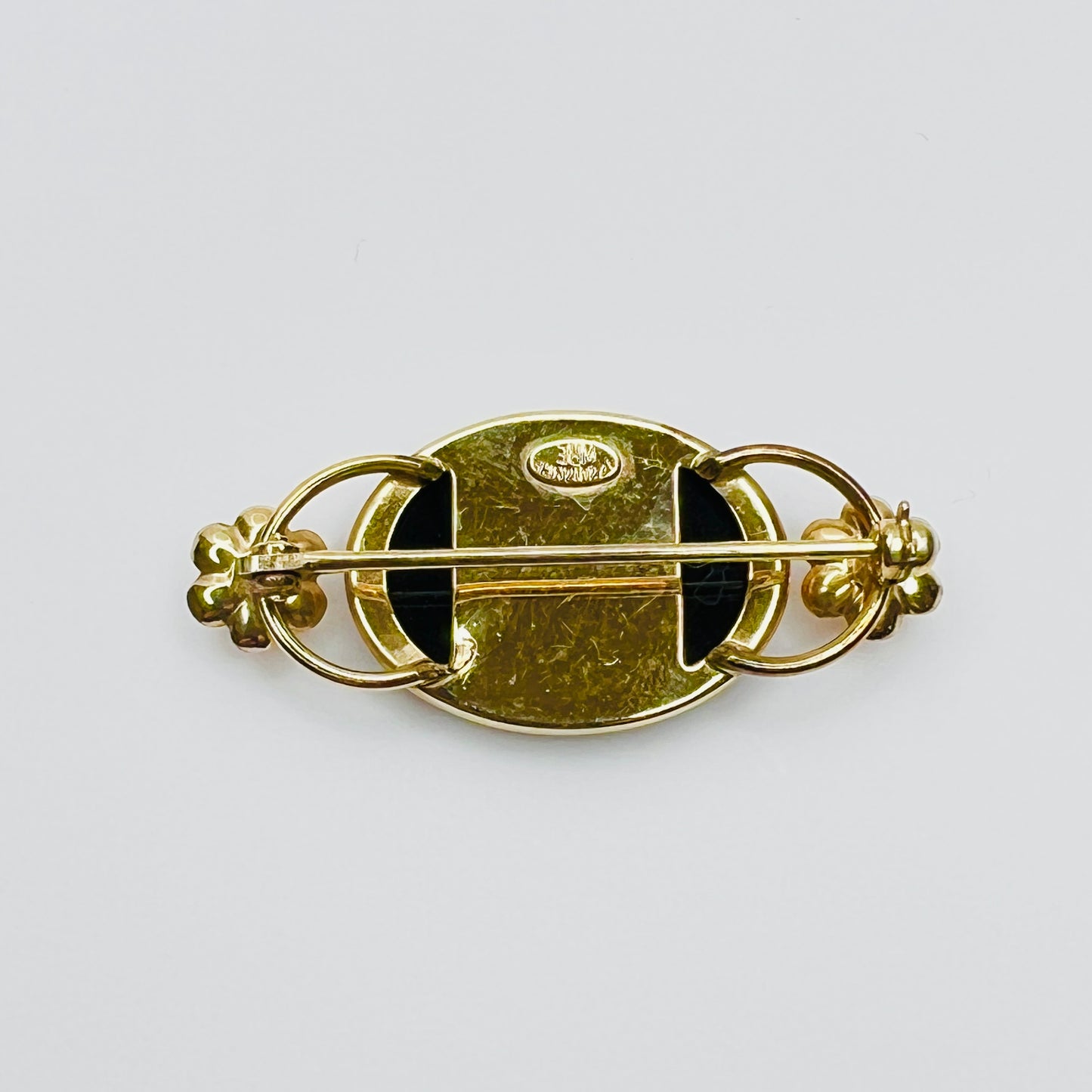 Back of brooch showing WRE 12K GF hallmark